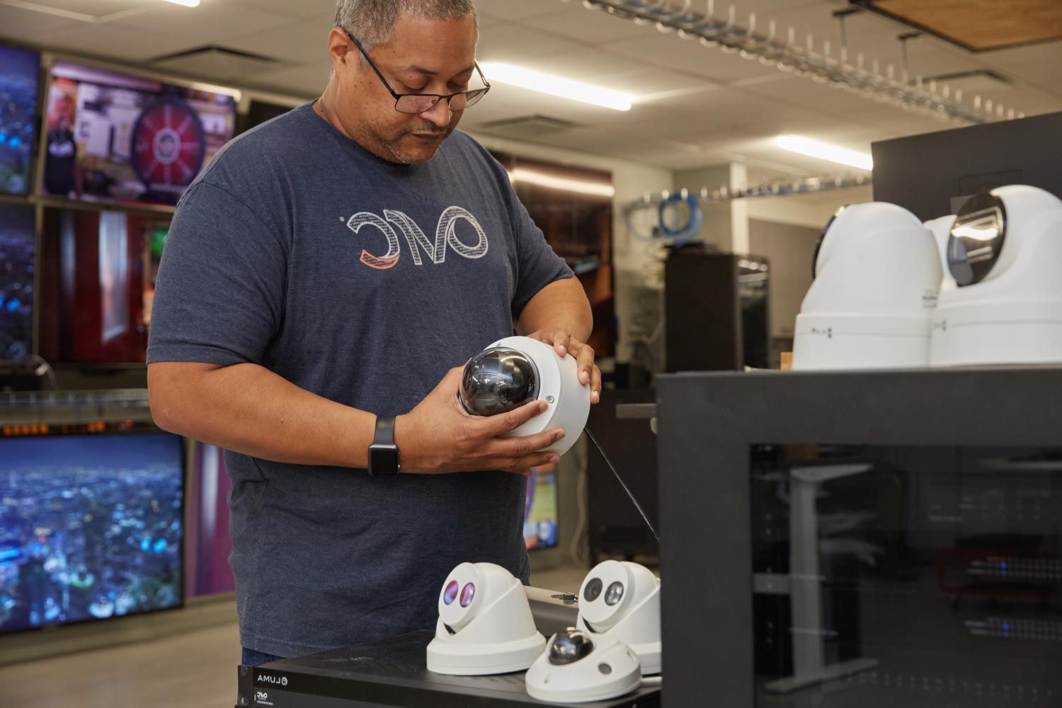 Person fixing security camera