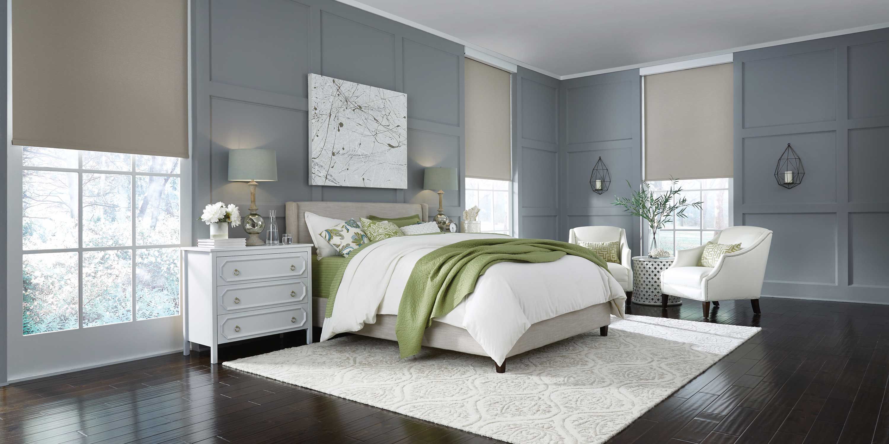 cool toned bedroom with lutron lighting and shades, white and green accents