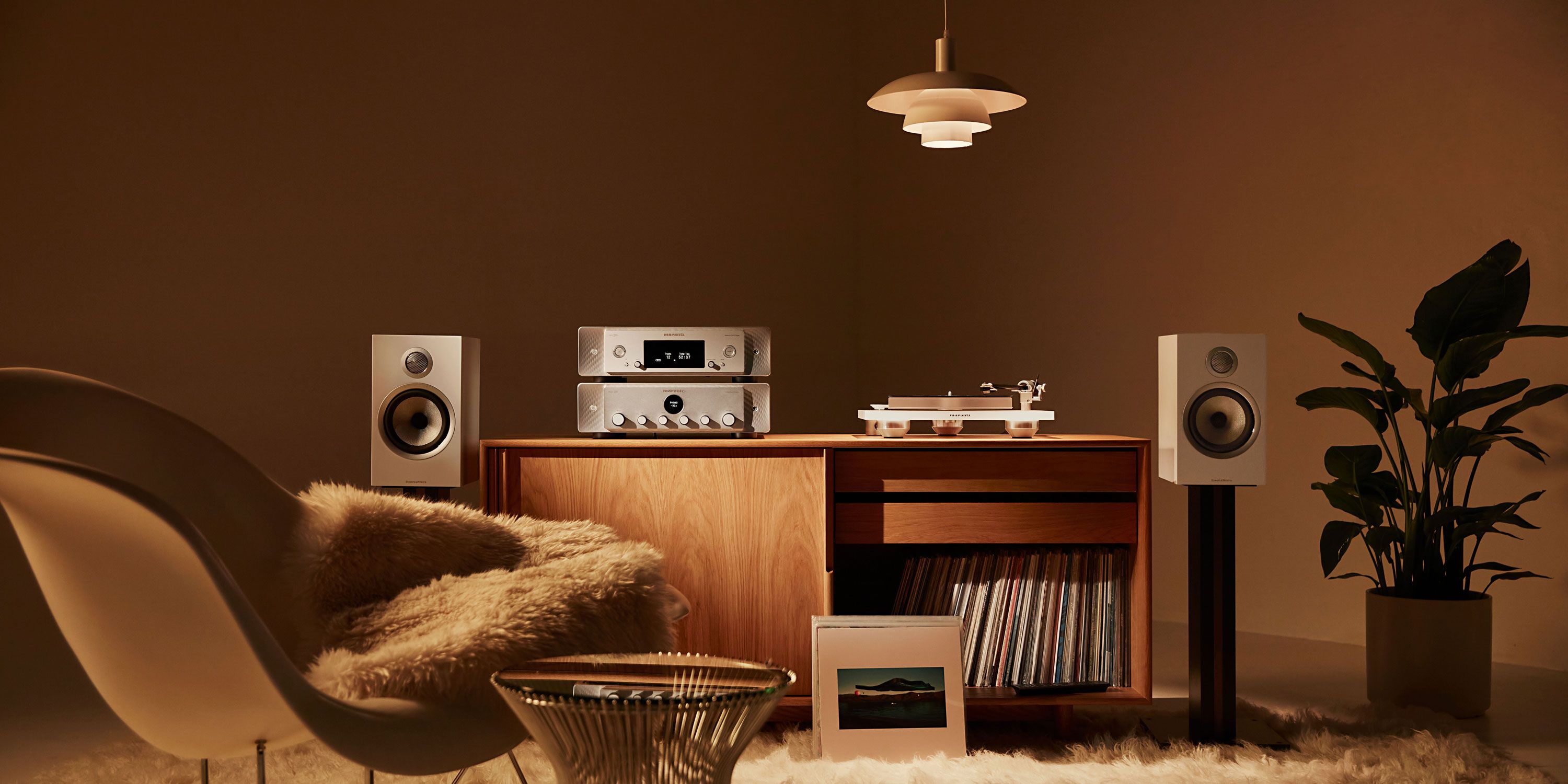 lush greenery in a room with bowers and wilkins speakers