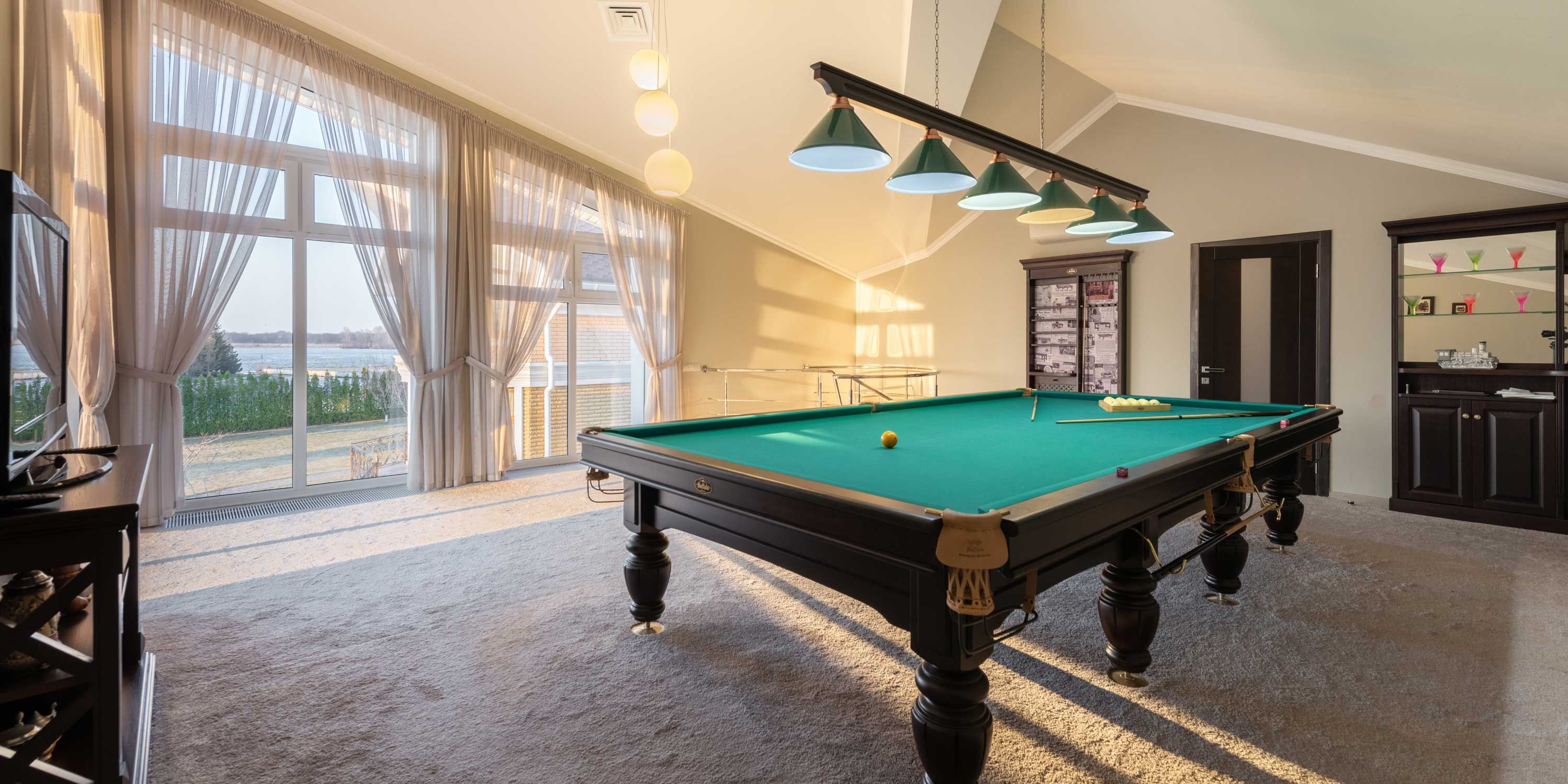 morning light in a game room with a pool table